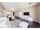 Bright open-concept living and dining space with hardwood floors, access to a modern kitchen, and modern decor at 8255 Las Vegas Blvd # 809, Las Vegas, NV 89123