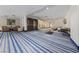 Inviting lobby area with comfortable seating and unique blue striped carpet at 8255 Las Vegas Blvd # 809, Las Vegas, NV 89123
