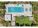 Aerial view of a large pool with plenty of lounge chairs and green landscaping at 8255 Las Vegas Blvd # 809, Las Vegas, NV 89123