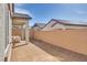Spacious backyard featuring low-maintenance landscaping, a covered patio, and privacy walls at 827 Klamath Springs St, Henderson, NV 89011