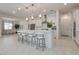 The open-concept kitchen offers an island with seating and modern finishes at 827 Klamath Springs St, Henderson, NV 89011