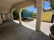 Backyard featuring a covered patio with outdoor trampoline and play area at 8277 Orange Vale Ave, Las Vegas, NV 89131