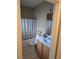 Bathroom featuring a tub and shower combo, vanity with storage, and tiled floors at 8277 Orange Vale Ave, Las Vegas, NV 89131