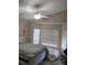 Inviting bedroom with neutral walls, large windows, and a ceiling fan at 8277 Orange Vale Ave, Las Vegas, NV 89131