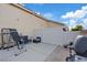 Fenced backyard patio space featuring a grill and lounge area, great for outdoor living at 8550 Little Fox St, Las Vegas, NV 89123