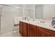 Bathroom featuring a double sink vanity, and glass-enclosed shower, designed for convenience and style at 8550 Little Fox St, Las Vegas, NV 89123