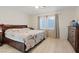 Cozy bedroom featuring a bed, dresser, and natural light, creating a peaceful retreat at 8550 Little Fox St, Las Vegas, NV 89123