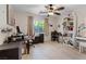 Spacious bedroom with a ceiling fan, natural light, and wood-look floors, perfect for relaxation at 8550 Little Fox St, Las Vegas, NV 89123