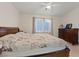 Comfortable bedroom featuring a bed, dresser, and natural light, creating a peaceful retreat at 8550 Little Fox St, Las Vegas, NV 89123