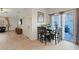 Cozy dining area off the kitchen with tiled floors and backyard access at 8550 Little Fox St, Las Vegas, NV 89123