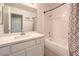 Modern bathroom with a shower and bathtub combination and new vanity at 8712 Texas Bronco Ave, Las Vegas, NV 89129