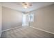 Comfortable carpeted bedroom with natural light and a closet at 8712 Texas Bronco Ave, Las Vegas, NV 89129