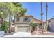 Lovely two-story home boasting a manicured front yard and a convenient two-car garage at 8712 Texas Bronco Ave, Las Vegas, NV 89129