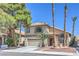 Charming two-story home featuring a well-manicured front yard and attached two-car garage at 8712 Texas Bronco Ave, Las Vegas, NV 89129