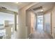 Upstairs hallway with vaulted ceilings, arched doorways, and carpeted floors at 8712 Texas Bronco Ave, Las Vegas, NV 89129
