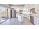 Updated kitchen features stainless steel appliances, white cabinets, and quartz countertops, offering style and functionality at 8712 Texas Bronco Ave, Las Vegas, NV 89129