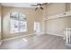 Inviting living room featuring high ceilings, large windows, and neutral-toned walls at 8712 Texas Bronco Ave, Las Vegas, NV 89129
