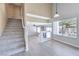 Well-lit living room with stairs and modern flooring providing a comfortable space at 8712 Texas Bronco Ave, Las Vegas, NV 89129