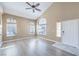 Bright, open living room with vaulted ceilings, large windows, and modern flooring at 8712 Texas Bronco Ave, Las Vegas, NV 89129