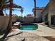 Backyard pool with mature landscaping, stone features, and a spacious stamped concrete patio at 8712 Texas Bronco Ave, Las Vegas, NV 89129