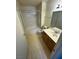Neutral bathroom features a shower-tub combination, standard toilet, and a sink with vanity at 9070 Spring Mountain Rd # 109, Las Vegas, NV 89117