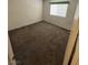 Standard sized bedroom with a window and neutral colored carpeted floors at 9070 Spring Mountain Rd # 109, Las Vegas, NV 89117