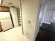 View of the kitchen leading to a hallway, closet, and an exterior door at 9070 Spring Mountain Rd # 109, Las Vegas, NV 89117