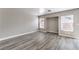 A bright, neutrally decorated bedroom featuring stylish laminate flooring and large windows at 9129 Patrick Henry Ave, Las Vegas, NV 89149