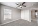 Bright bedroom features a ceiling fan, neutral paint, and closet for ample storage at 9129 Patrick Henry Ave, Las Vegas, NV 89149