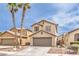 Charming two-story home featuring a two-car garage and desert landscaping at 9129 Patrick Henry Ave, Las Vegas, NV 89149