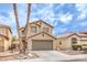 Charming two-story home featuring a two-car garage, desert landscaping, and tile roof at 9129 Patrick Henry Ave, Las Vegas, NV 89149