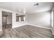 A bright, neutrally decorated living room featuring stylish laminate flooring and open concept at 9129 Patrick Henry Ave, Las Vegas, NV 89149