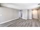 An airy, neutrally decorated living room featuring stylish laminate flooring and white doors at 9129 Patrick Henry Ave, Las Vegas, NV 89149