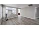 A bright, neutrally decorated living room featuring stylish laminate flooring and open space at 9129 Patrick Henry Ave, Las Vegas, NV 89149