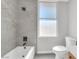Clean bathroom features a tub, shower combo, and modern finishes at 913 Duckhorn Ct # 201, Las Vegas, NV 89144