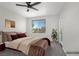 Bedroom with a plant and a large window with a view to the exterior at 913 Duckhorn Ct # 201, Las Vegas, NV 89144