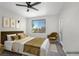 Bedroom with a plush armchair and a large window with a view to the exterior at 913 Duckhorn Ct # 201, Las Vegas, NV 89144