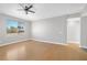 Bright bedroom with hardwood floors and a large window overlooking the neighborhood at 913 Duckhorn Ct # 201, Las Vegas, NV 89144