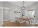 Dining room featuring wood floors, modern light fixture and balcony access at 913 Duckhorn Ct # 201, Las Vegas, NV 89144