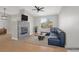 Bright living room features a fireplace, vaulted ceiling with fan, and view to the exterior at 913 Duckhorn Ct # 201, Las Vegas, NV 89144