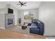 Bright living room features a fireplace, vaulted ceiling with fan, and view to the exterior at 913 Duckhorn Ct # 201, Las Vegas, NV 89144