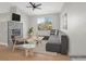 Bright living room features a fireplace, vaulted ceiling with fan, and view to the exterior at 913 Duckhorn Ct # 201, Las Vegas, NV 89144