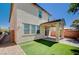 Beautiful two-story home features a covered patio and a well-manicured backyard at 9217 Valley Betica Ave, Las Vegas, NV 89148