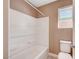 Bathroom offering a tub-shower combination and a toilet, enhanced by a window for natural light at 9217 Valley Betica Ave, Las Vegas, NV 89148