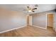Bright bedroom features light-colored wood floors, neutral colored walls, and a closet at 9217 Valley Betica Ave, Las Vegas, NV 89148