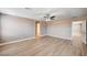 Light-filled bedroom features wood floors, neutral walls, and easy access to ensuite bathroom at 9217 Valley Betica Ave, Las Vegas, NV 89148