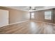 Bright bedroom with natural light, wood floors, and a ceiling fan provides a peaceful personal space at 9217 Valley Betica Ave, Las Vegas, NV 89148