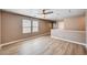 Bonus room with wood-look floors, light walls, and natural light from the window creates a welcoming space at 9217 Valley Betica Ave, Las Vegas, NV 89148