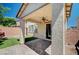 Charming covered patio overlooks an artificial lawn and a block wall at 9217 Valley Betica Ave, Las Vegas, NV 89148