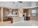 Modern kitchen featuring stainless steel appliances, granite countertops, and updated subway tile backsplash at 9217 Valley Betica Ave, Las Vegas, NV 89148